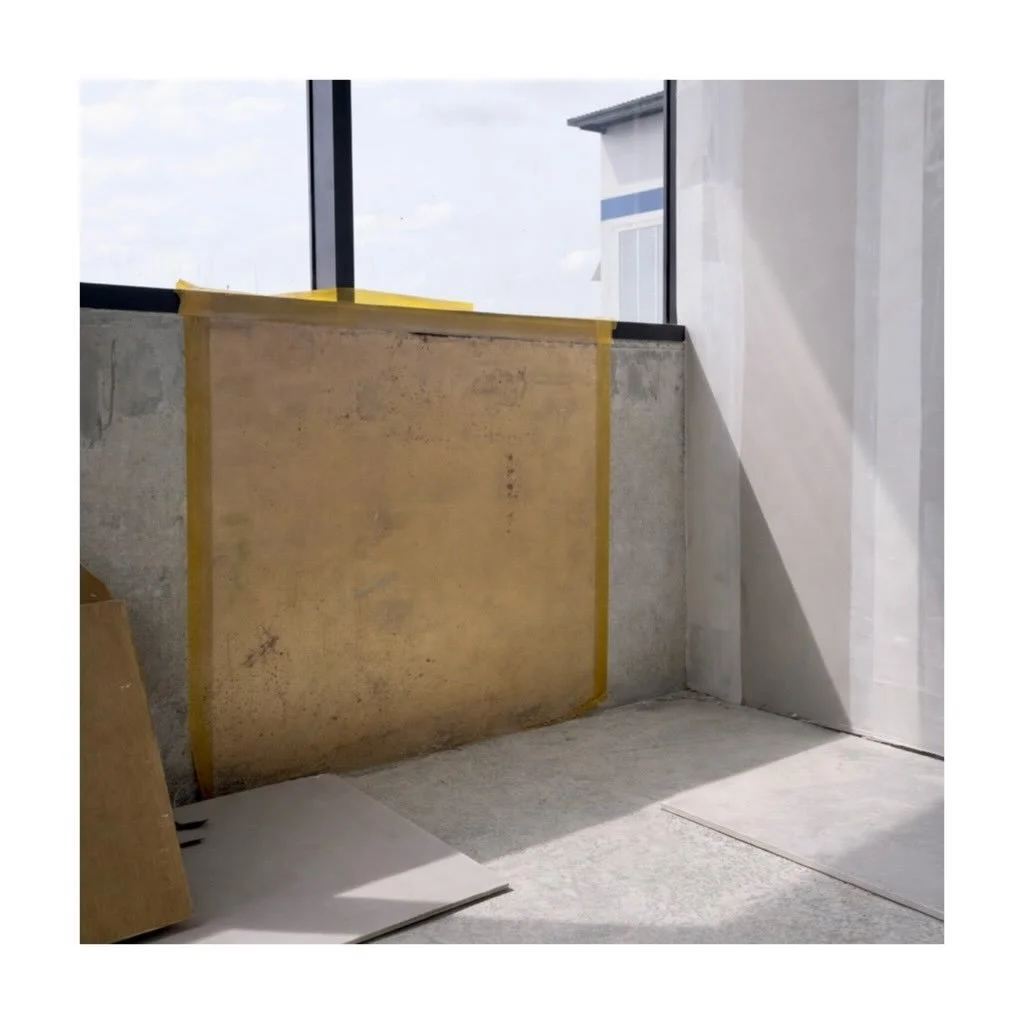 In our recently completed workplace project in Singapore, before any finishes are applied, two simple gestures were made directly onto the raw concrete - A gold square and a red square.

Placed in collaboration with a Feng Shui master, each carries i
