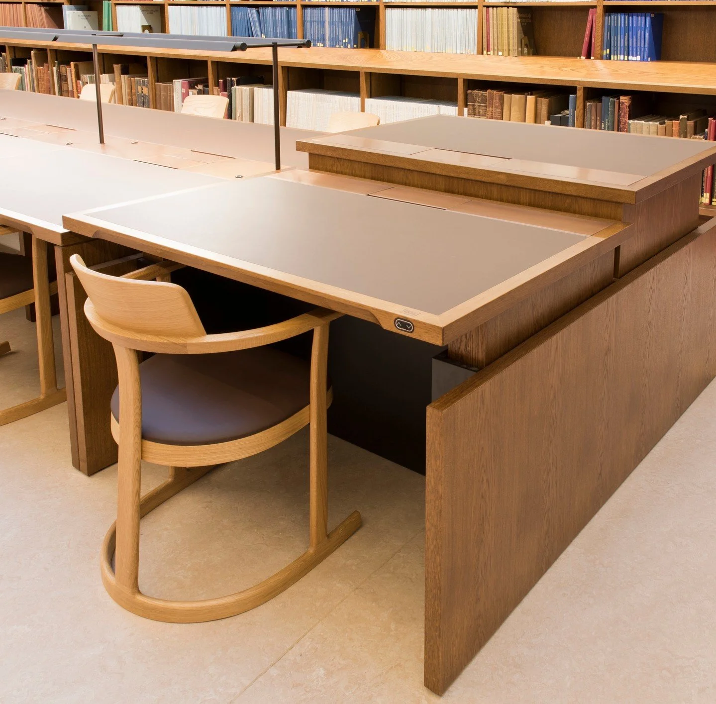 Bodleian Libraries &ndash; 80 readers desks with integrate cable management and lighting. End desks shown in this image designed as sit/stand. 

All are finished in stained oak with antiqued gilded metal detailing.

#BodleianLibraries #HistoricDesign