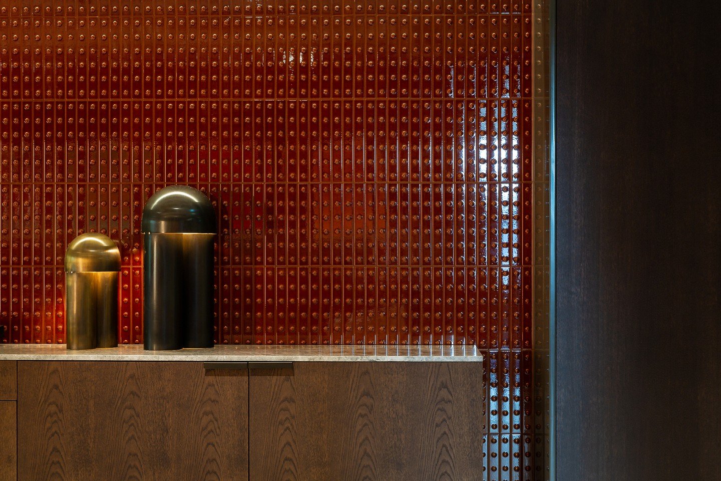 This bespoke credenza sits against a statement high-gloss red textured wall and sculptural mushroom lighting. It&rsquo;s a perfect example of how our London-made furniture anchors an international interior.

The European Oak is finished to a 'dead ma