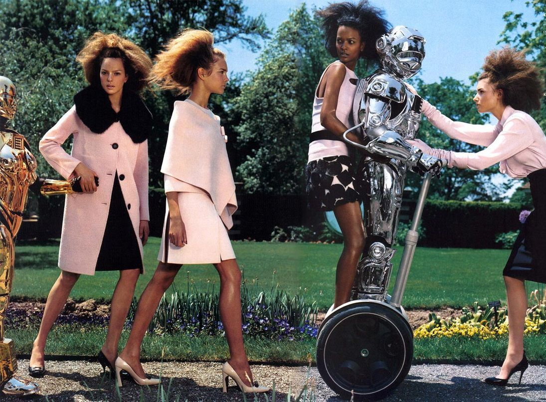 Robot on Segway accompanied by women