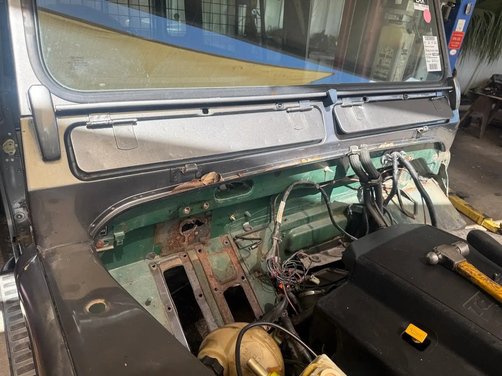 Rusty bulkhead and footwell on a stripped Land Rover Defender