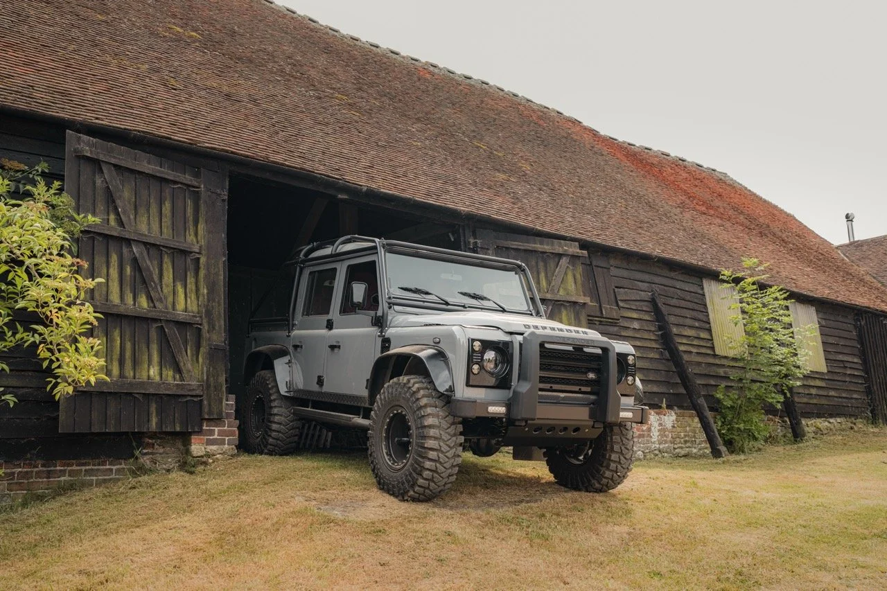 Land Rover Defender in desert terrain