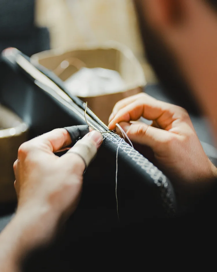Hand-stitching leather trim for a Shoreline Defender