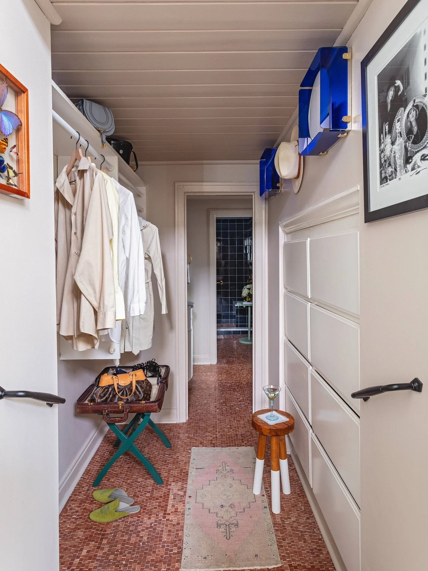 It&rsquo;s the details that shape the experience. A stool by @serenaandlily adds texture and function, @waterworks tile grounds the palette, and @urbanelectric wall lights bring a punch of blue brilliance. The vintage suitcase&mdash;restored as a gif