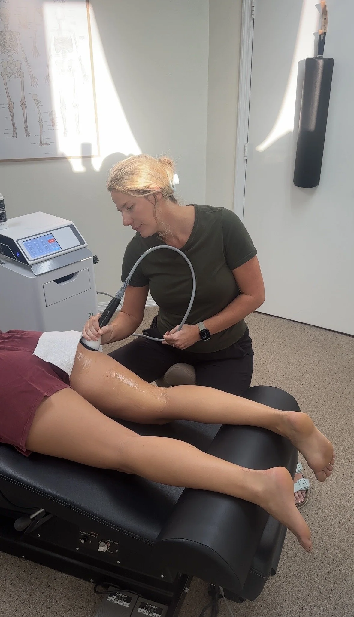 Dr. Sandy performing StemWave in Sarasota Florida on a hamstring problem for a iron man athlete
