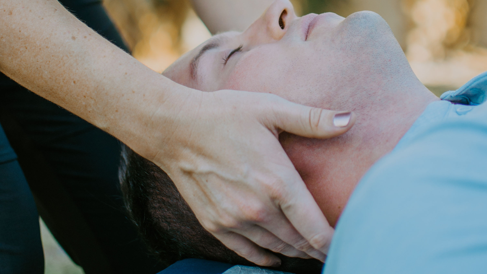 Dr. Sandy performing active release on a patient with migraines