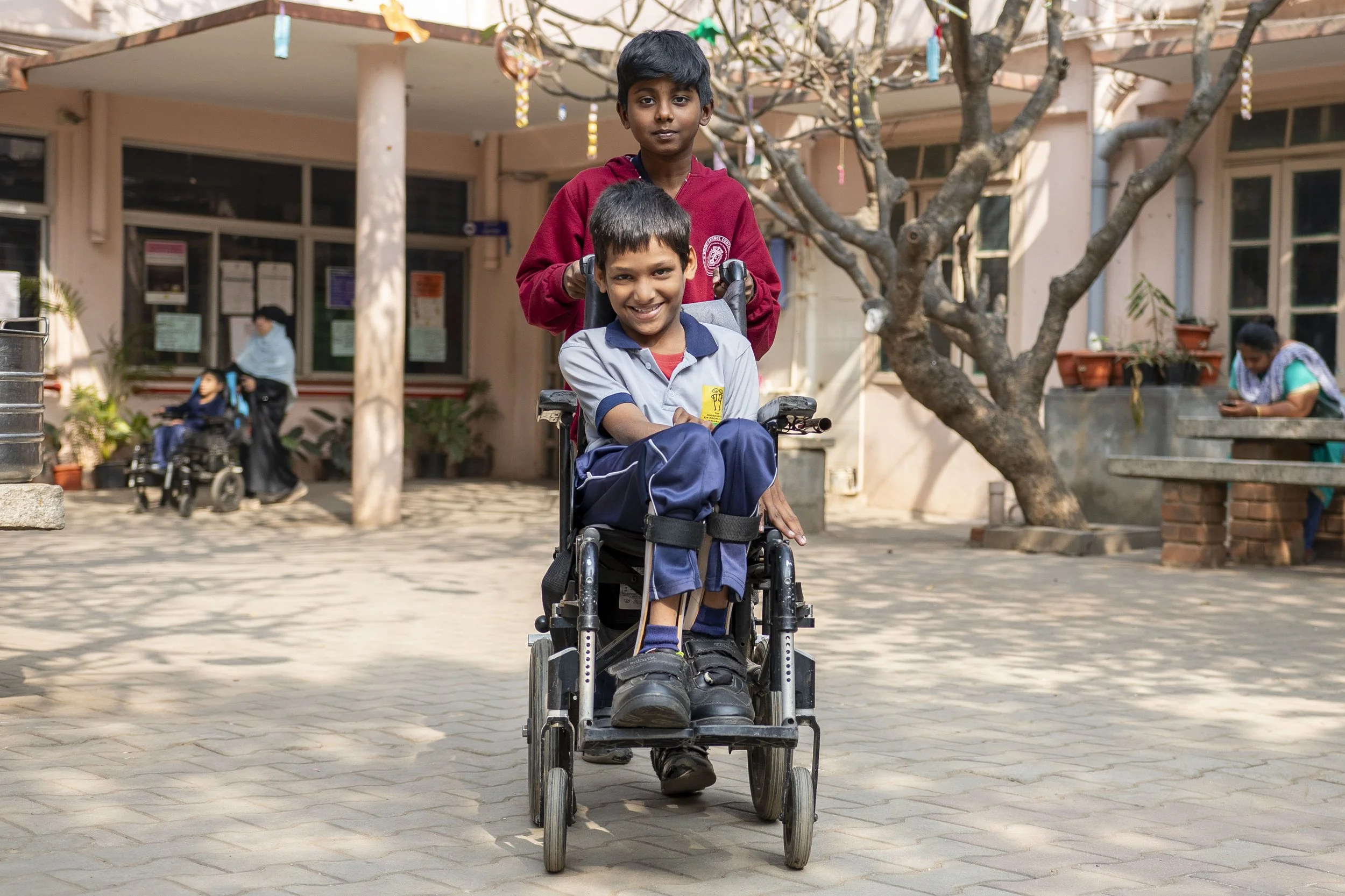 APD_SCHOOL_STUDENT_DAMAN_PUSHING_WHEELCHAIR_0632.JPG