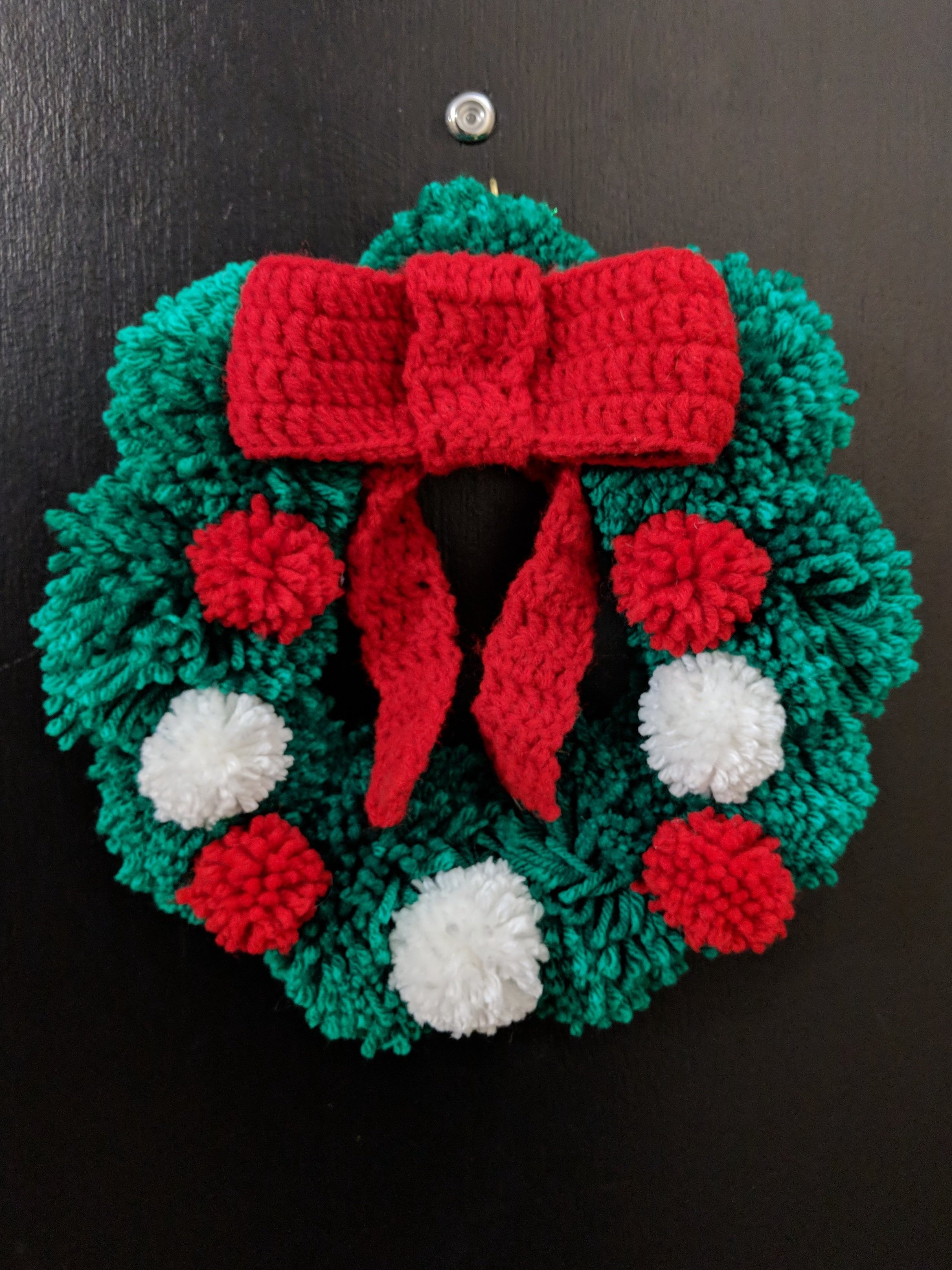 DIY Yarn Christmas Pom Pom Wreath - That Craft Site - fun and easy