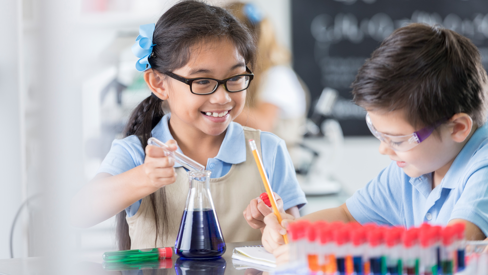 Students participating in a hands-on science activity at Christ Little Rock School with engaging private education.