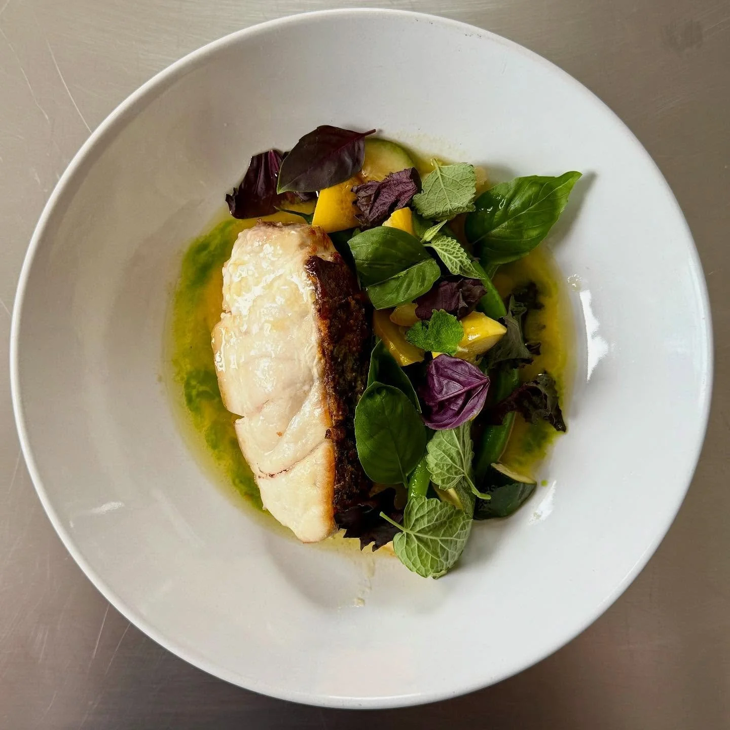 Sometime you just get out of the way and let the ingredients just speak for themselves.  Perfectly cooked wild stripped bass with crispy skin, beautiful local summer squash, green beans, fresh herbs.
#seasonality #simplicity