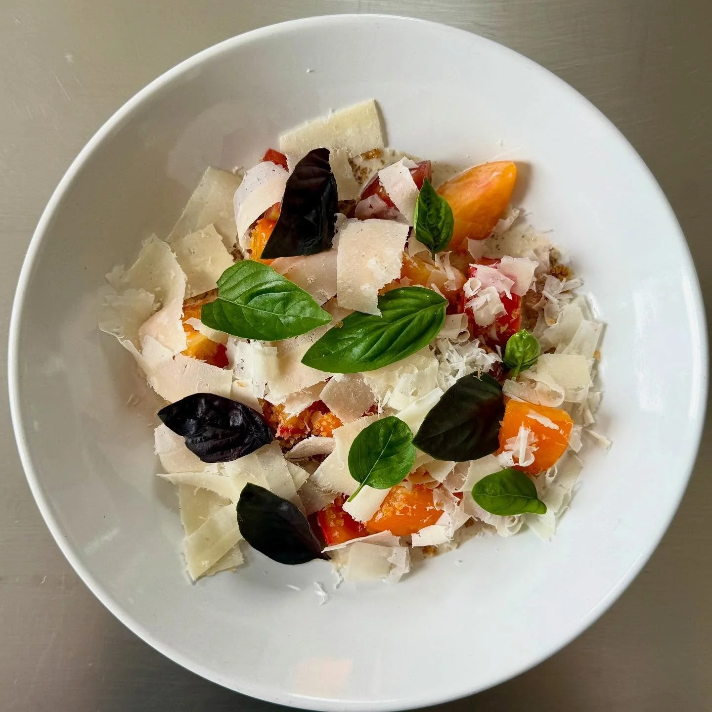 Happy Friday, friends!  Join us on the patio for our heirloom tomatoes&mdash;perfect for this lovely evening outdoors. Sourced from @downriverfarms, served with tonnato,  pangrattato, parmigiana, and fresh basil from our garden. #keepitsimple #season