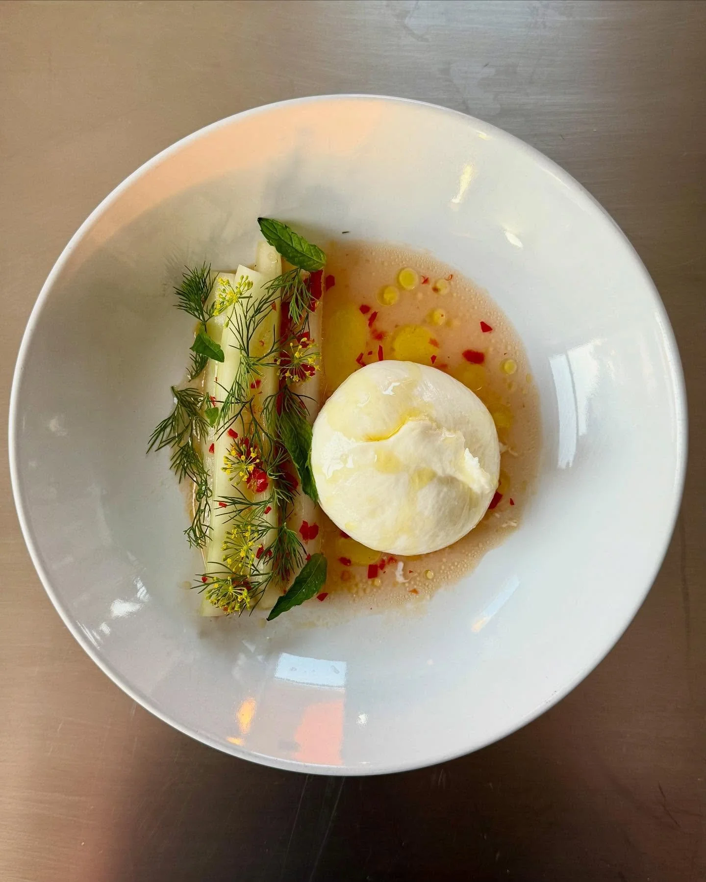 Perfect dish for hot summer days.  Cooling cucumbers from @downriverfarm, burrata, herbs from our garden.