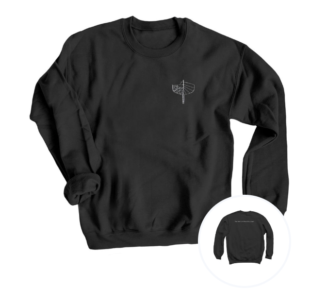 Black crewneck sweatshirt with a small white line drawing of a sailboat on the front left chest area, and the back has text that reads 'The Art of Boat Buliding'