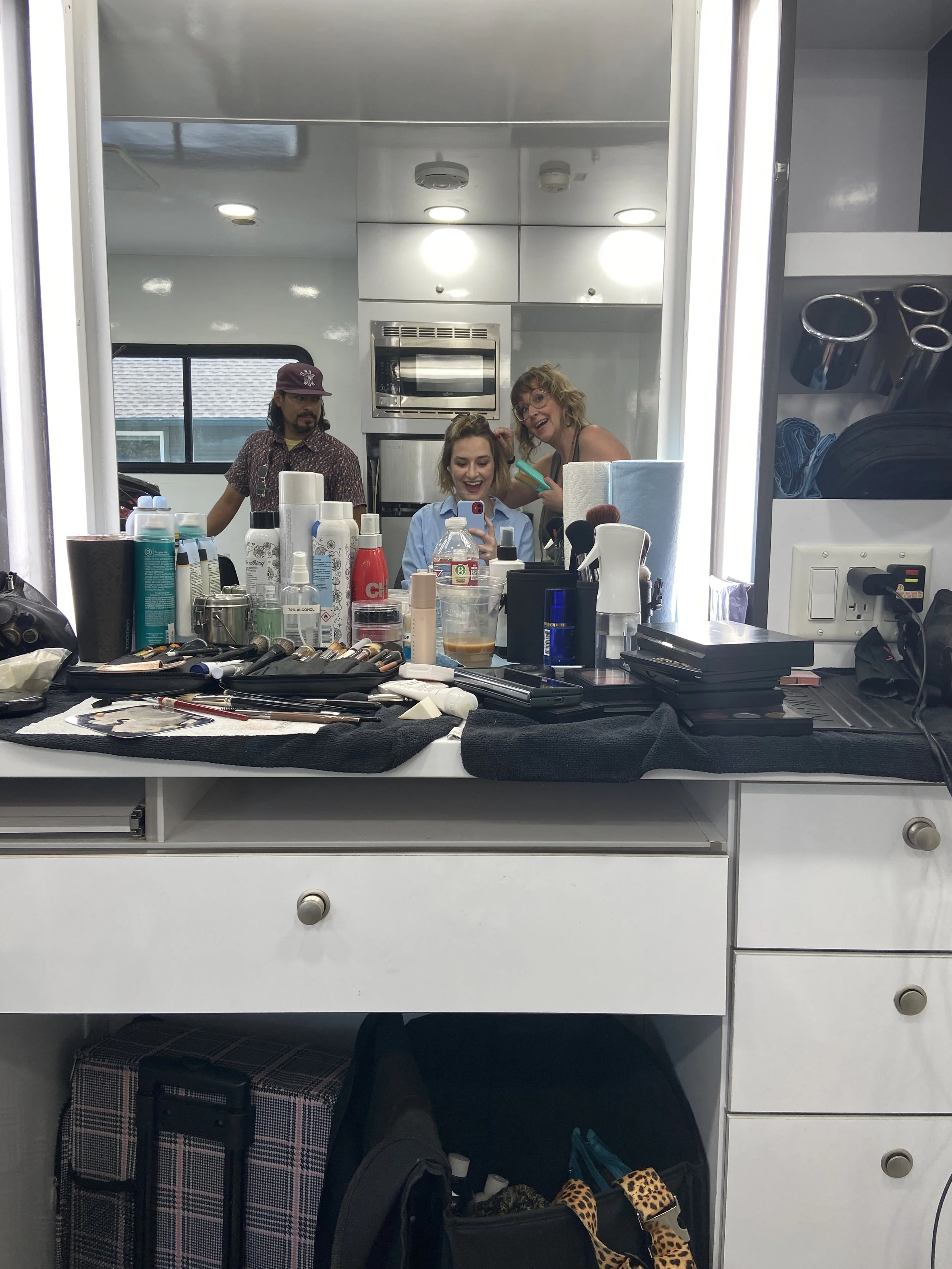 Darcy with makeup artist, Tara Cooper, on set for UFCU