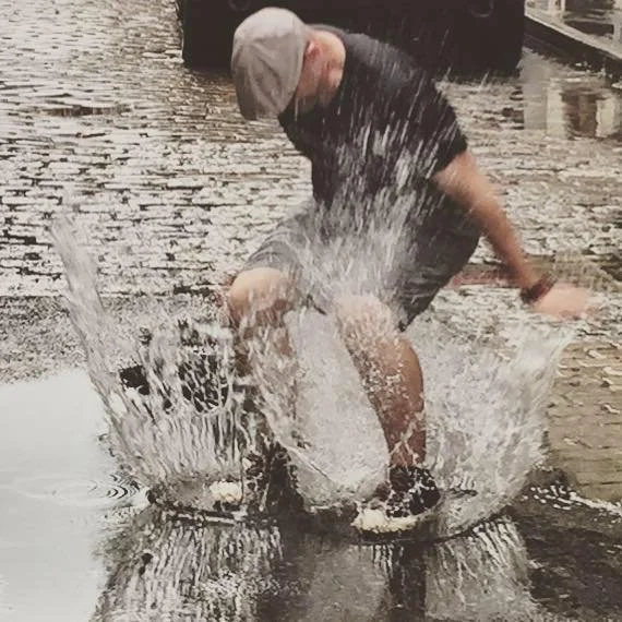Joe playing and splashing in water