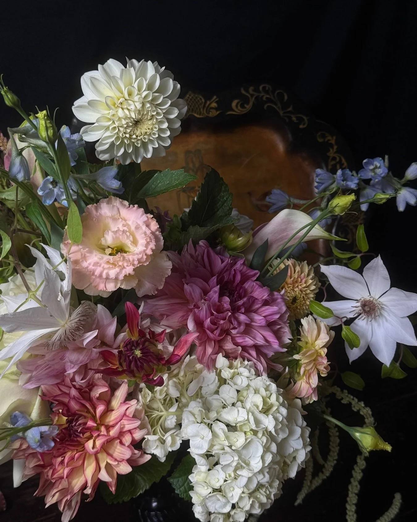 Spring&rsquo;s exit meets summer&rsquo;s arrival: delphinium &amp; clematis alongside dahlia, hydrangea, lisianthus &amp; trailing amaranthus