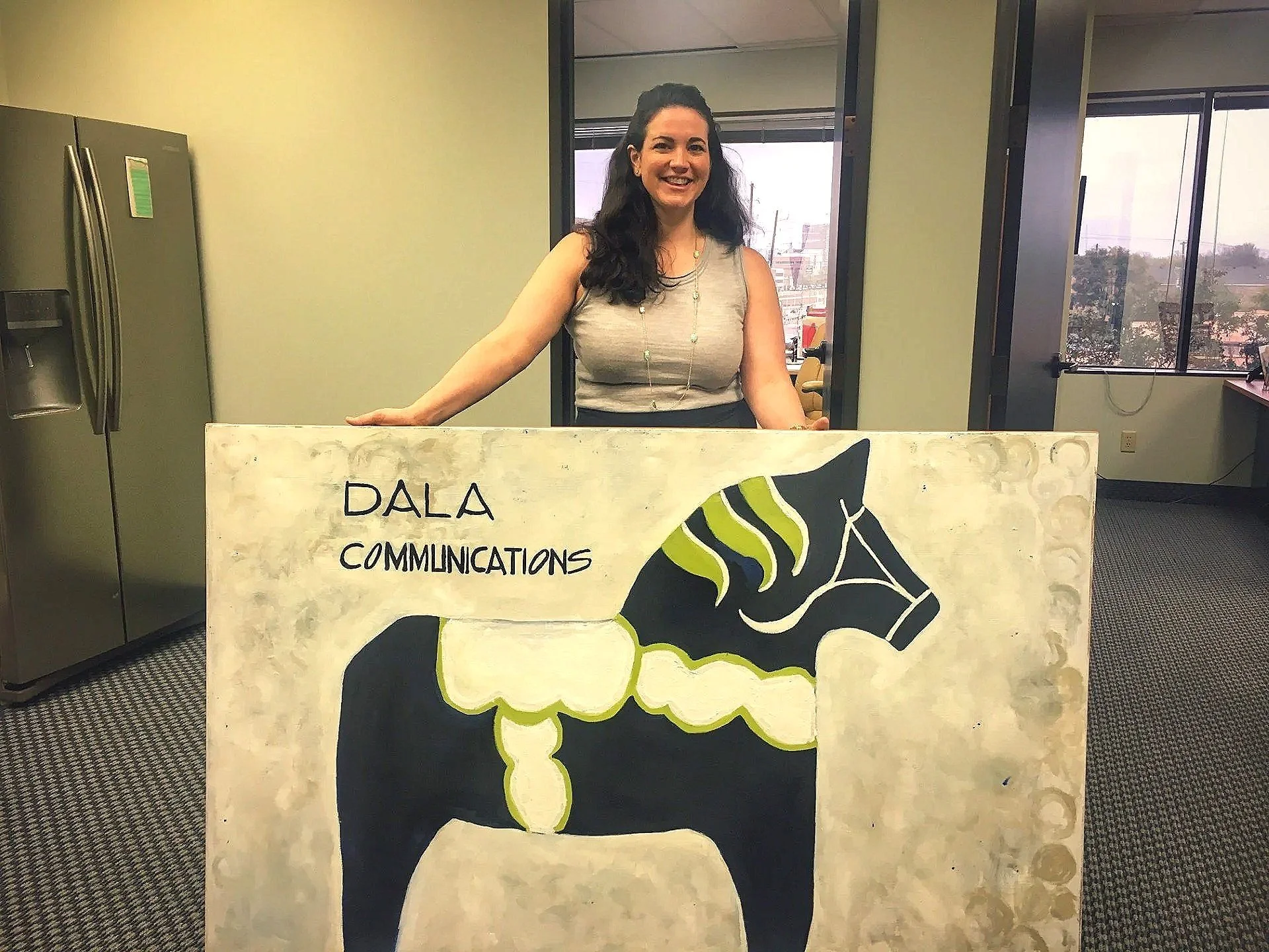  Leah with her Dala horse painting after the rebrand, painted by her aunt, another proud Swedish descendant and the daughter of her Swedish grandfather. 