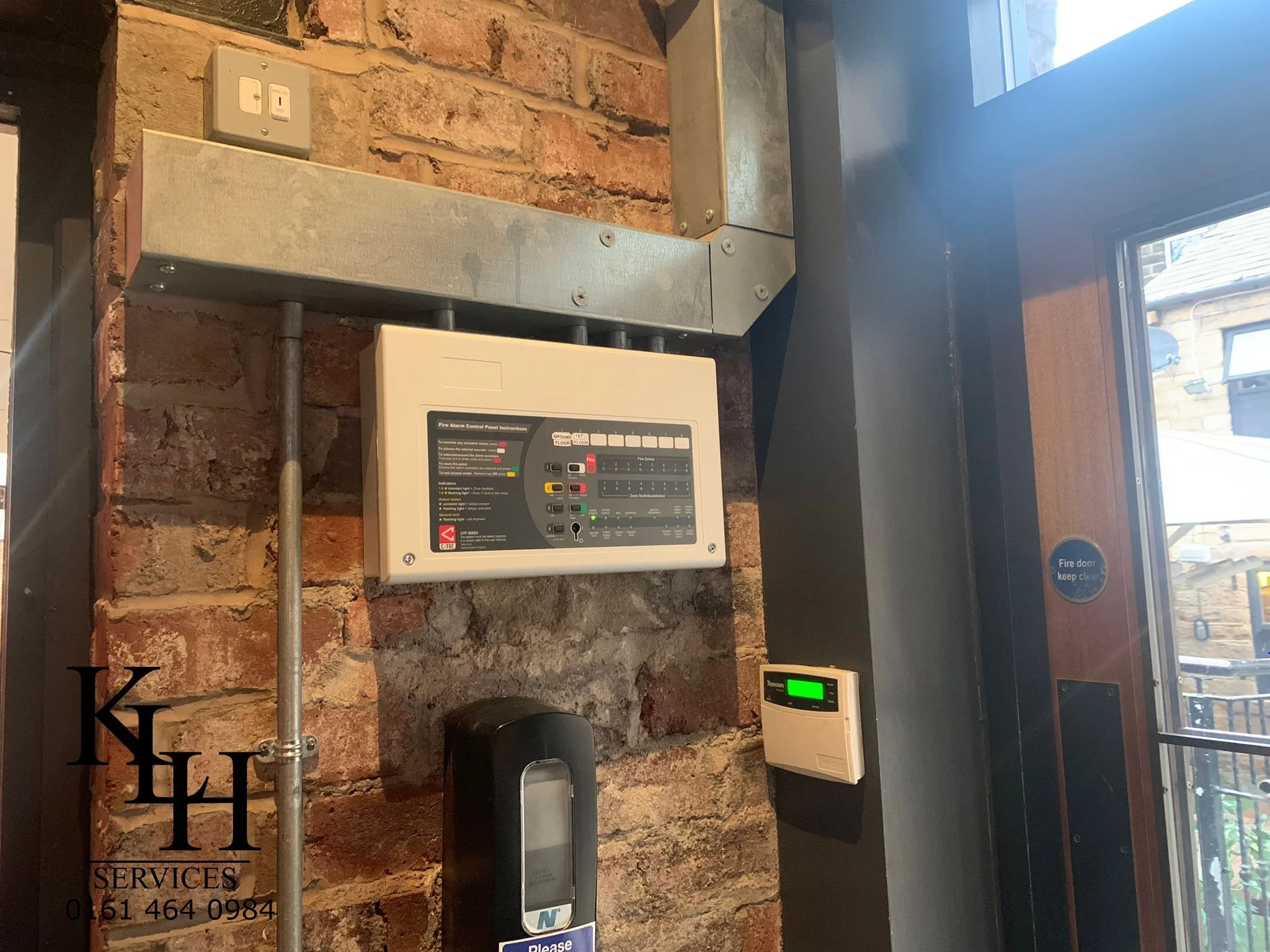 Fire alarm control panel installed in commercial property in Manchester.