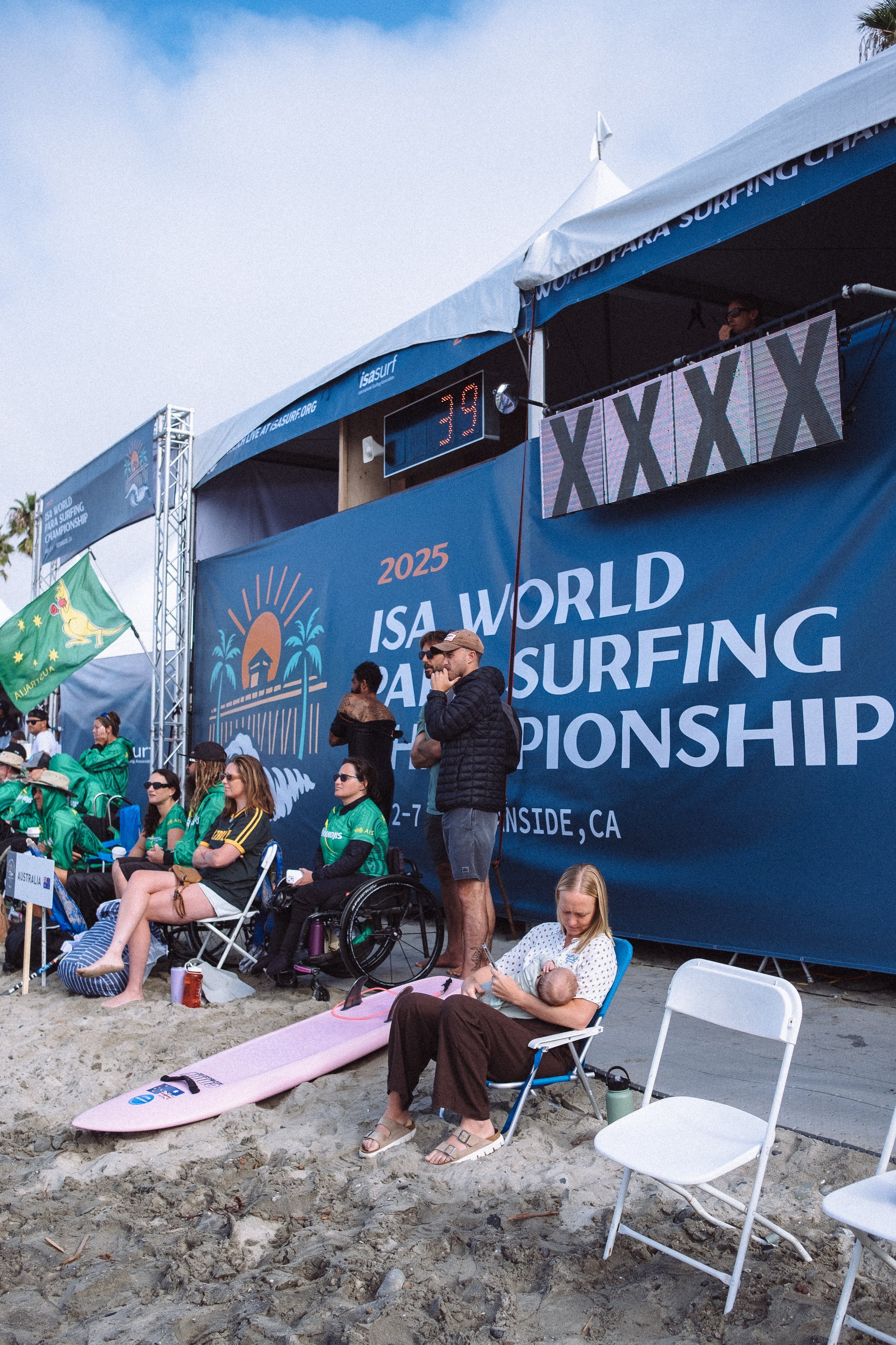 Shannon's turn to lead by example: feeding Dylan at mommy's first day back at work at the ISA World Parasurfing Championships 2025