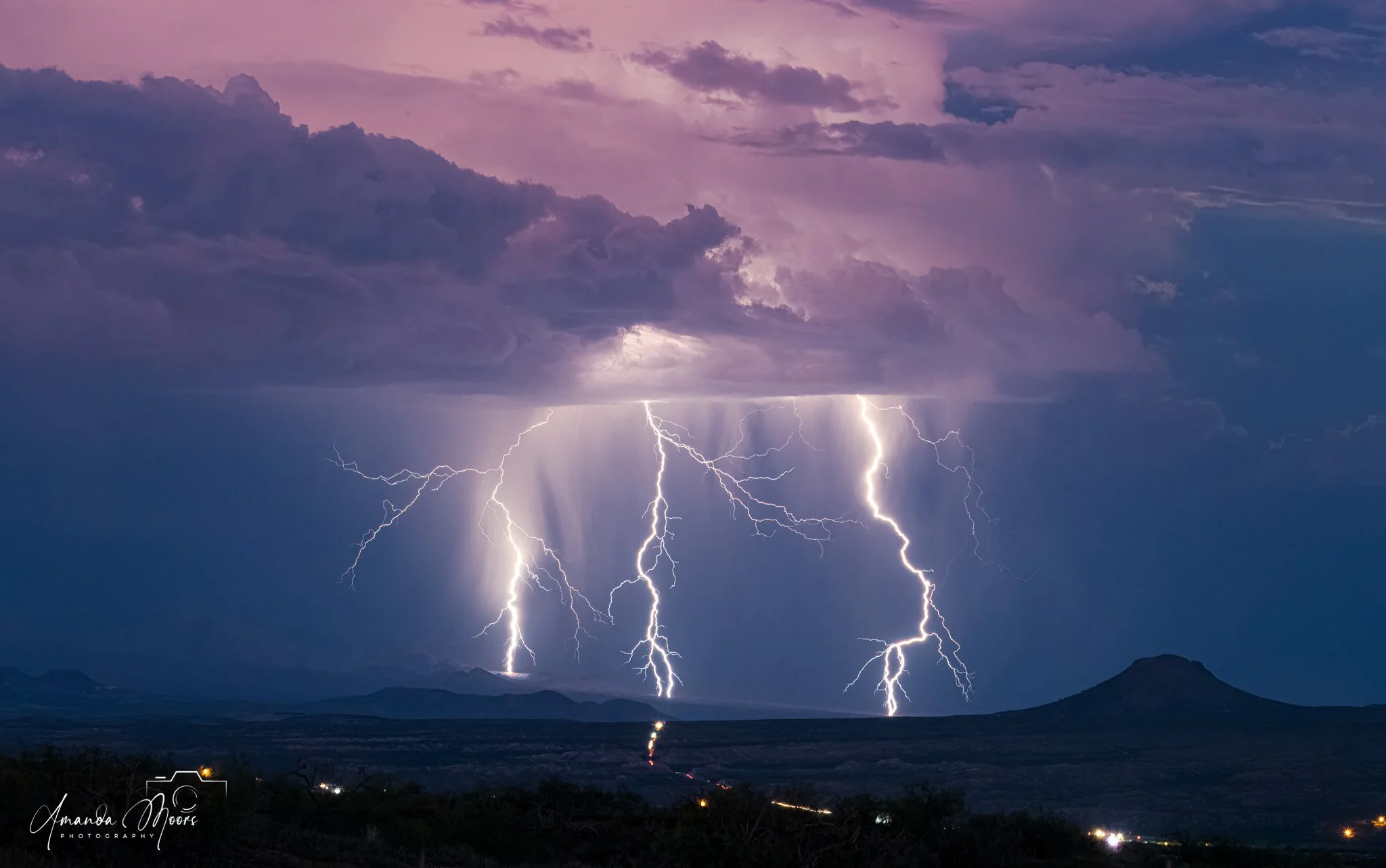 Three large lightning bolts strike over highway 70 in the eastern sky.  That night I had gone up a hill behind our neighborhood to photograph the full moon rise....however, I never saw the moon due to the clouds, fortunately, I was able to photograph
