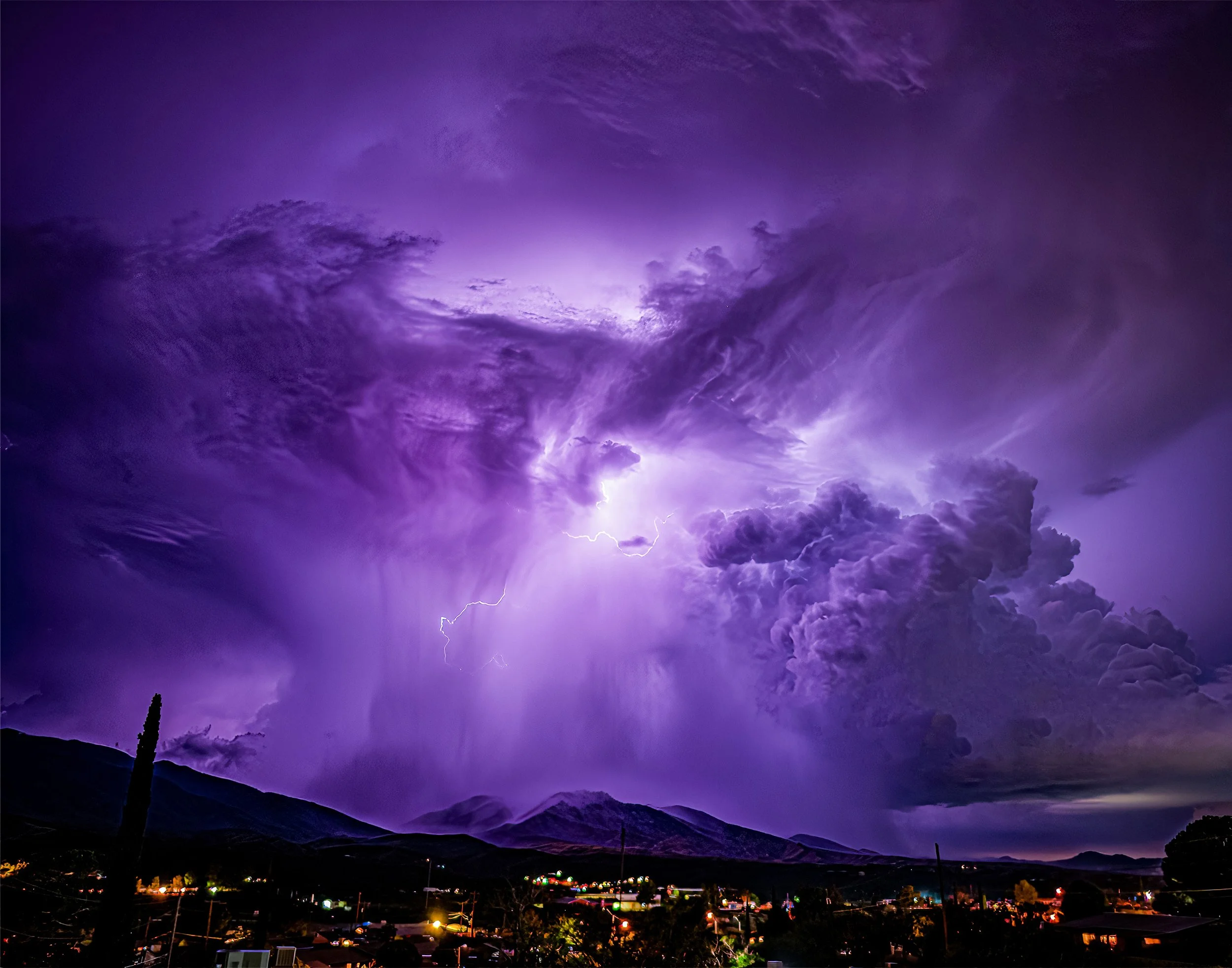 We watched this huge rain and lightning storm move across the Pinal Mountains...I took hundreds of photos of that storm and this one blew my mind!  An intense downpour of rain with all the clouds lit up by a flash of lightning!  The wind was blowing 