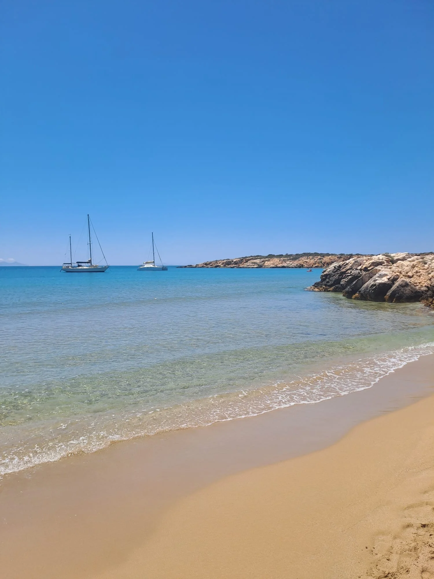 Sailboats moored in the bay at Faragas Beach on Paros Greece