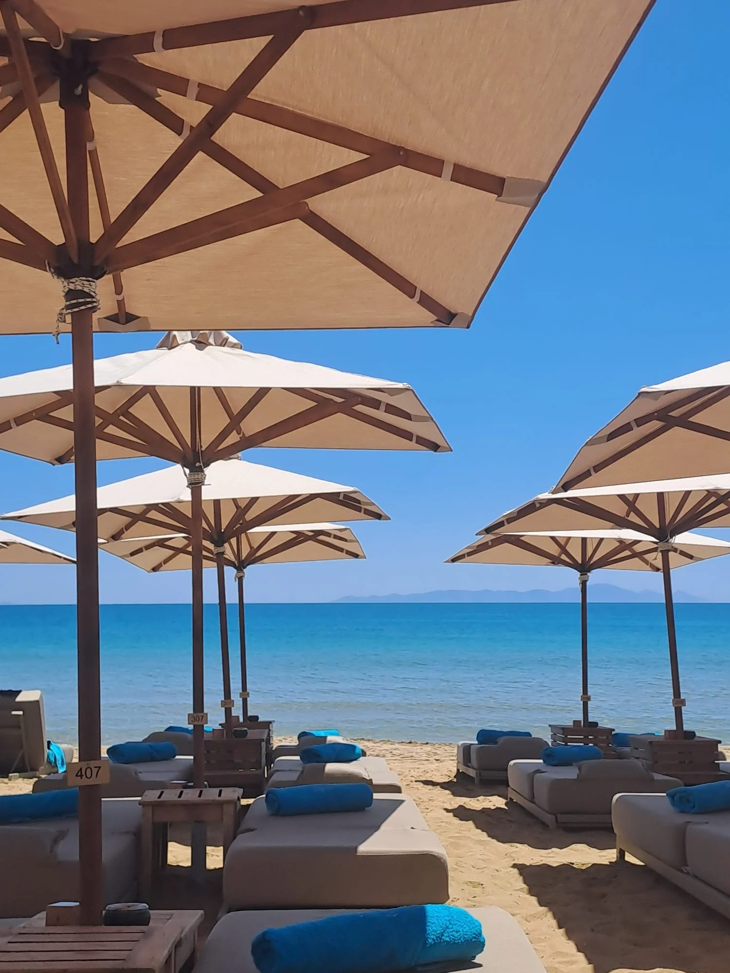 View of Faragas Beach from umbrellas and beach beds