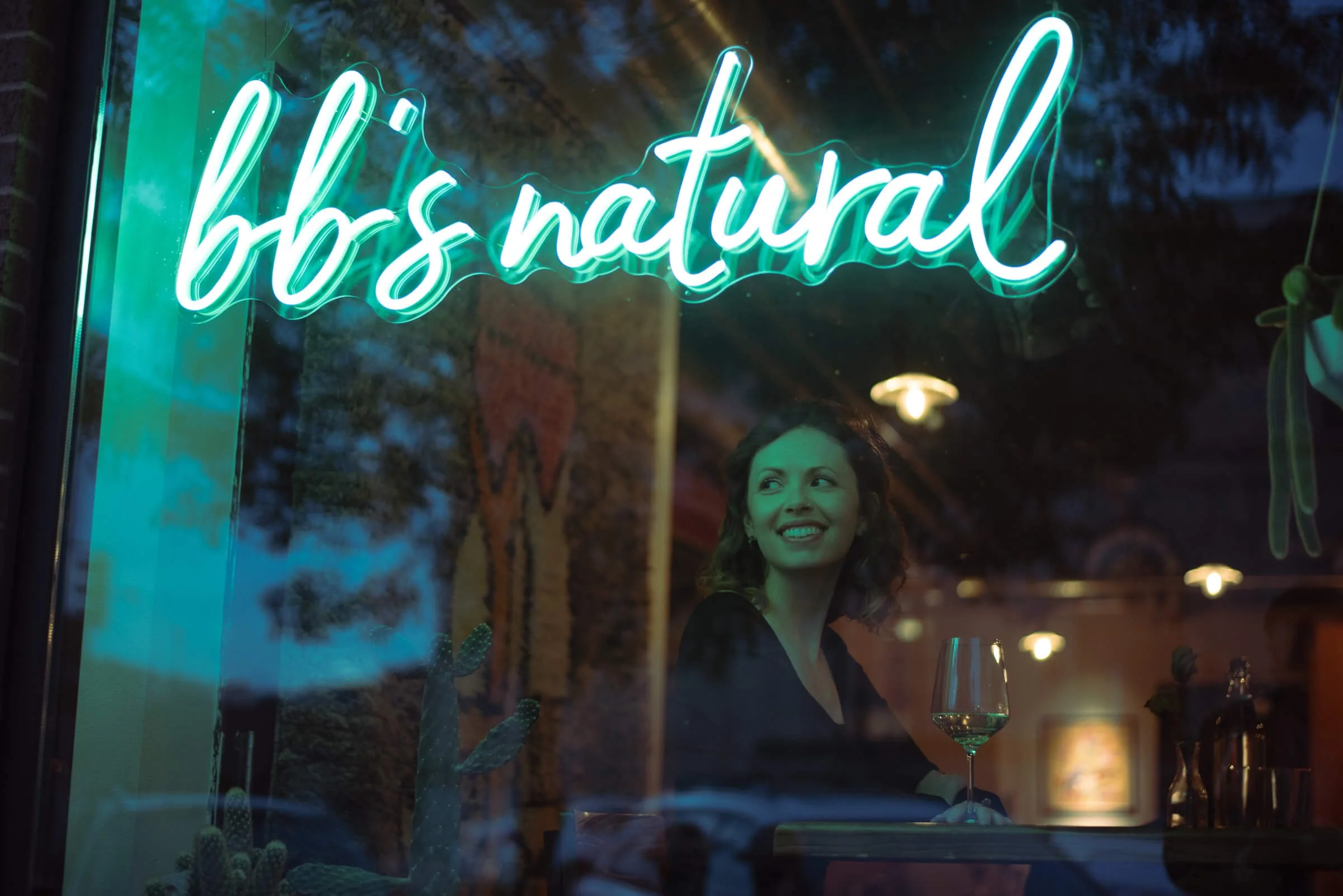 Professional portrait of a woman sitting in a wine bar in Rapid City, South Dakota