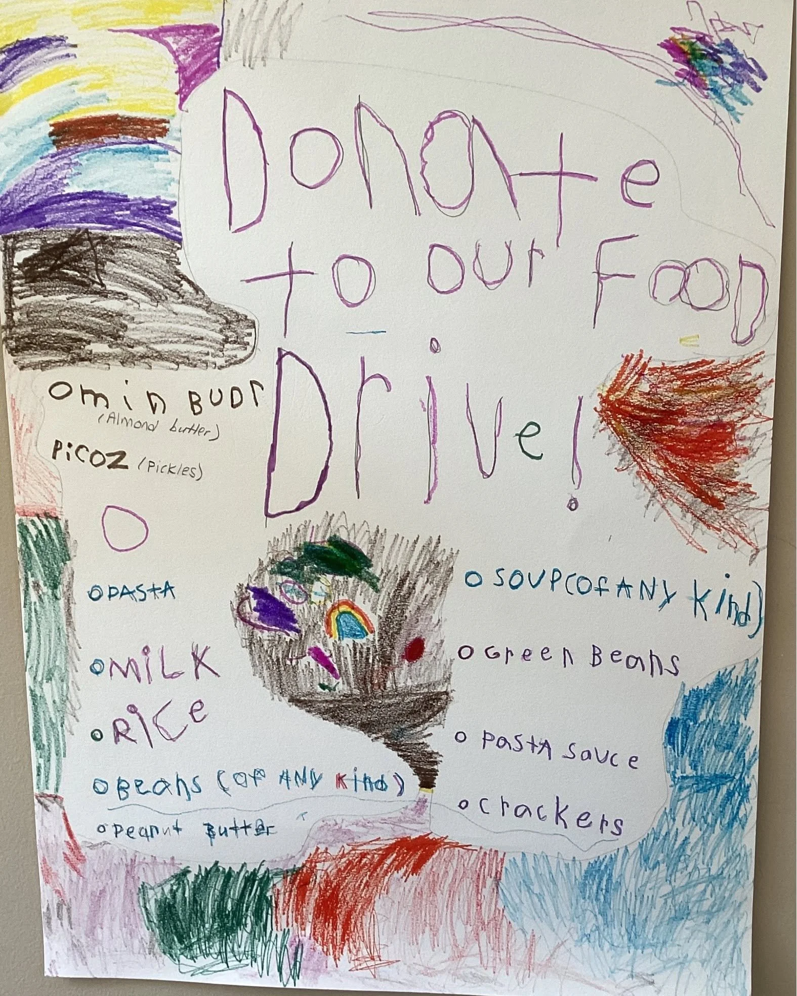 Colorful, hand-drawn poster with the phrase 'Donate to our food drive!' written in purple. The poster features several food items listed in different colors, including pasta, milk, rice, oats, peanut butter, chicken, crackers, and more. Various colorful scribbles, drawings, and a rainbow are also visible around the text.