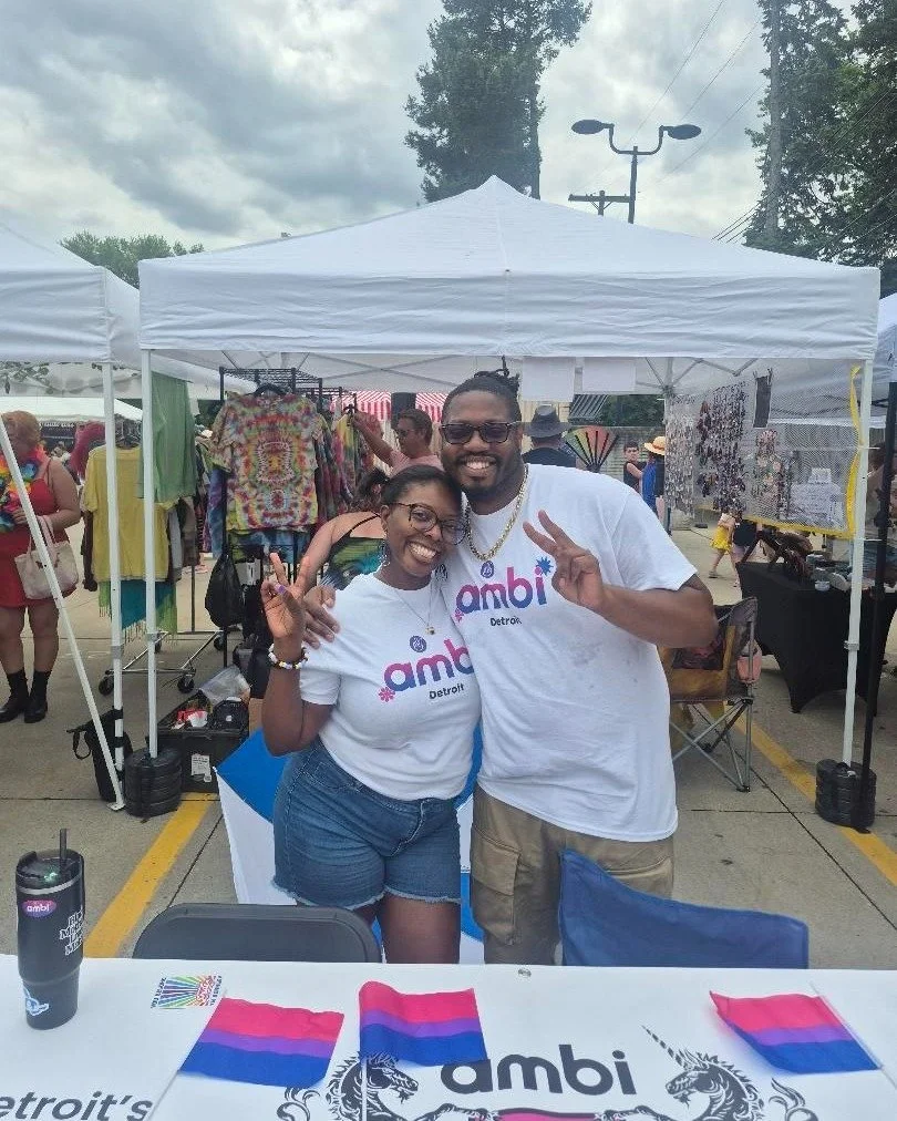 What's more bi: tiny bi flags or amBi Detroit throwing up peace signs?