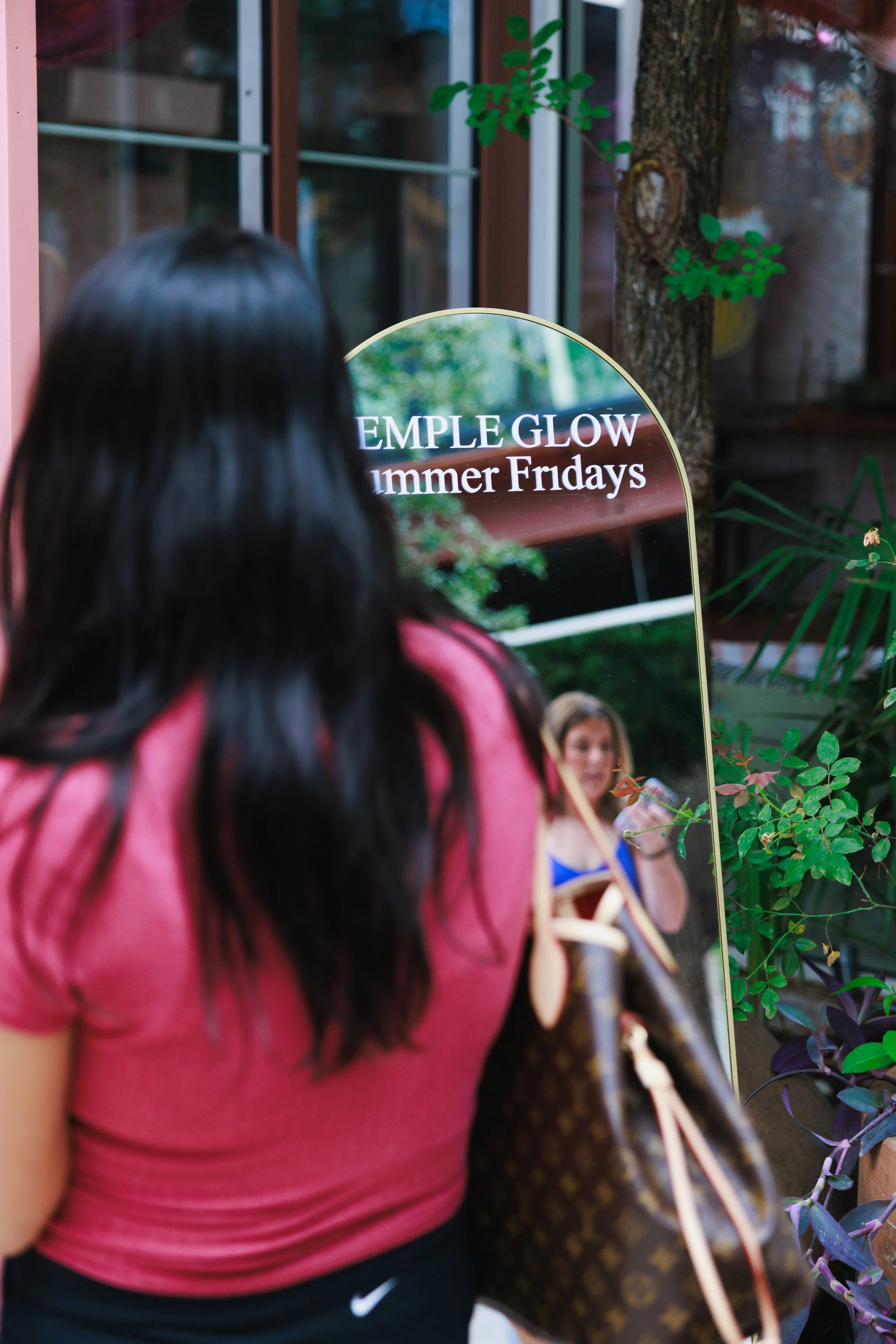 Dallas creators standing in a waiting line for a Temple studio wellness event.