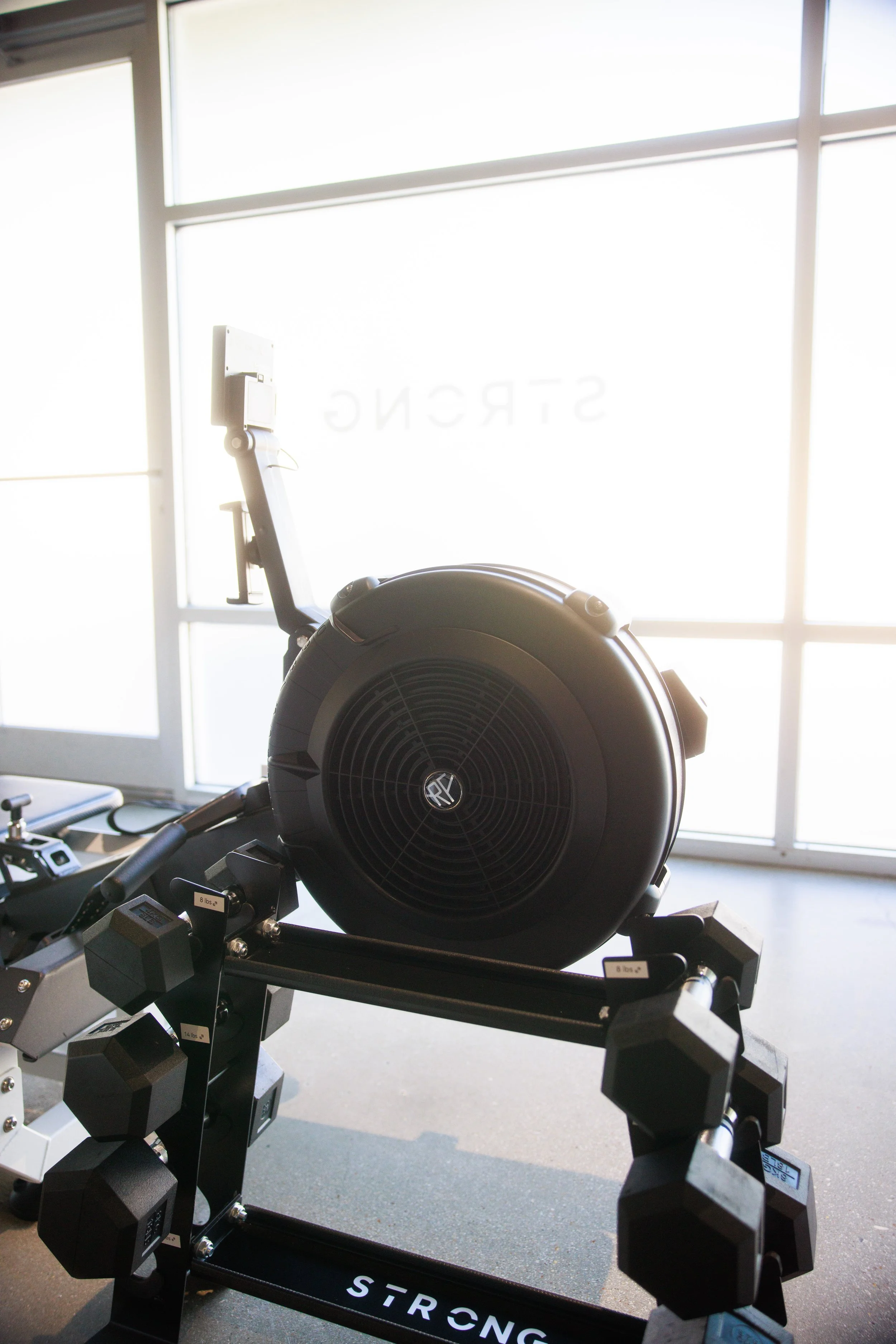 Detailed shot of a STRONG PILATES reformer machine.