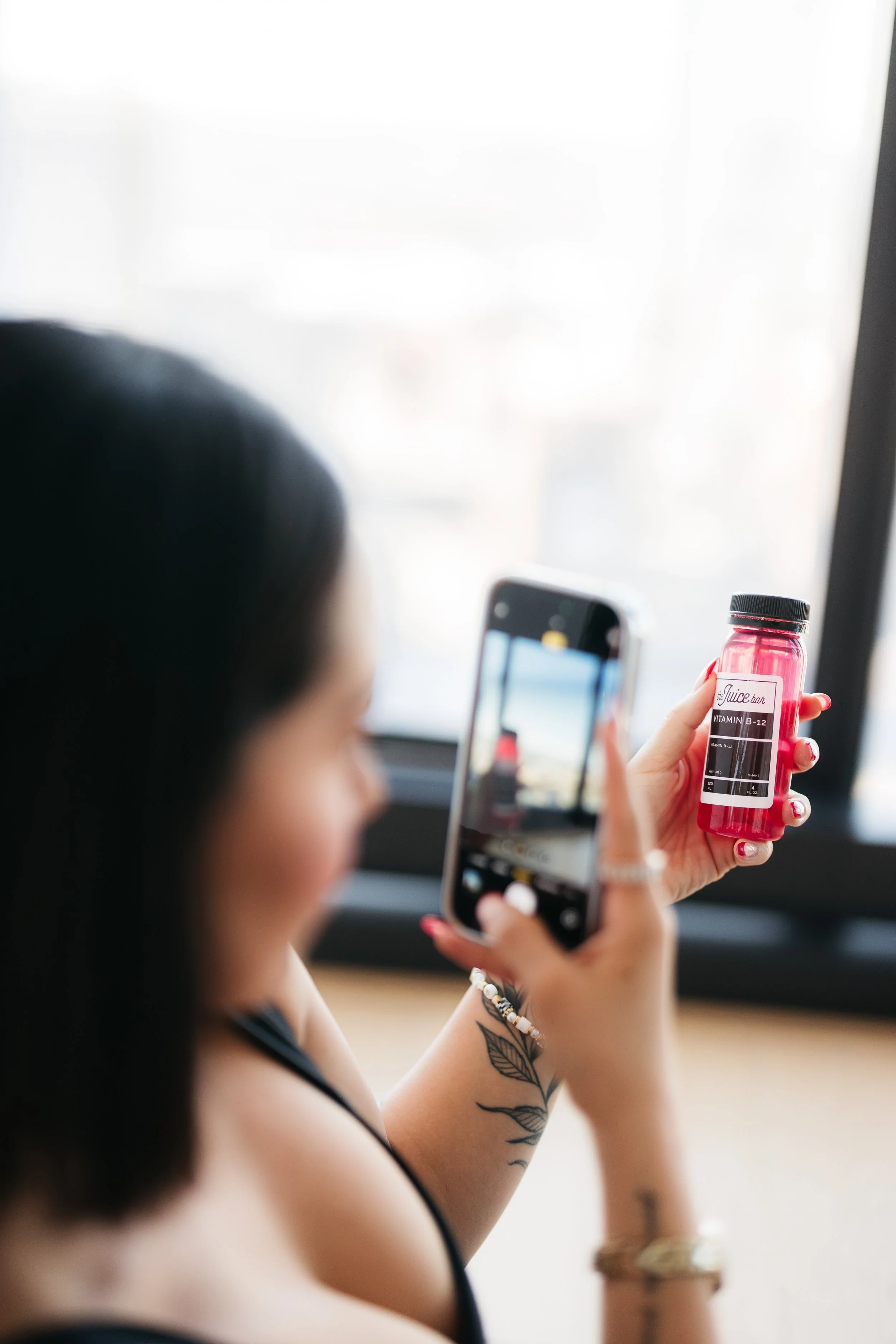 Dallas influencer creating content about a brand partner's product at an experiential marketing event in Dallas.