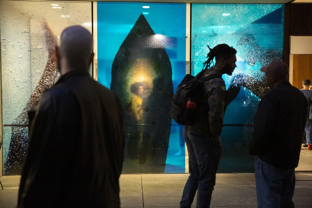  Vinyl prints of work from Huggins’ “Circa no Future” cover three windows of the KJCC’s atrium. 