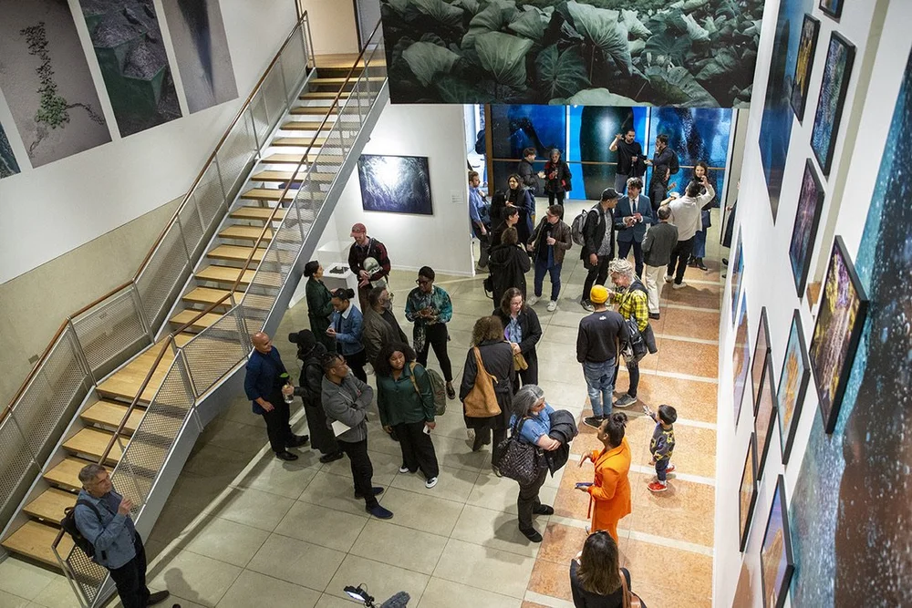  Visitors mingle on the first floor of the KJCC during the April 25 reception. 
