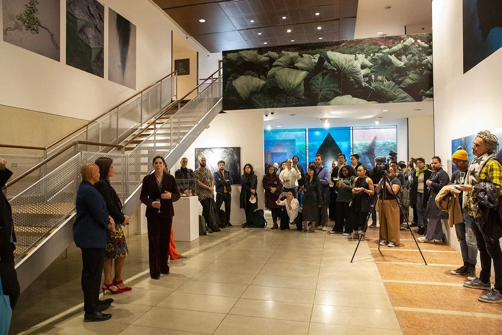  Attendees gather around the KJCC’s atrium as the speakers kick off the event. 