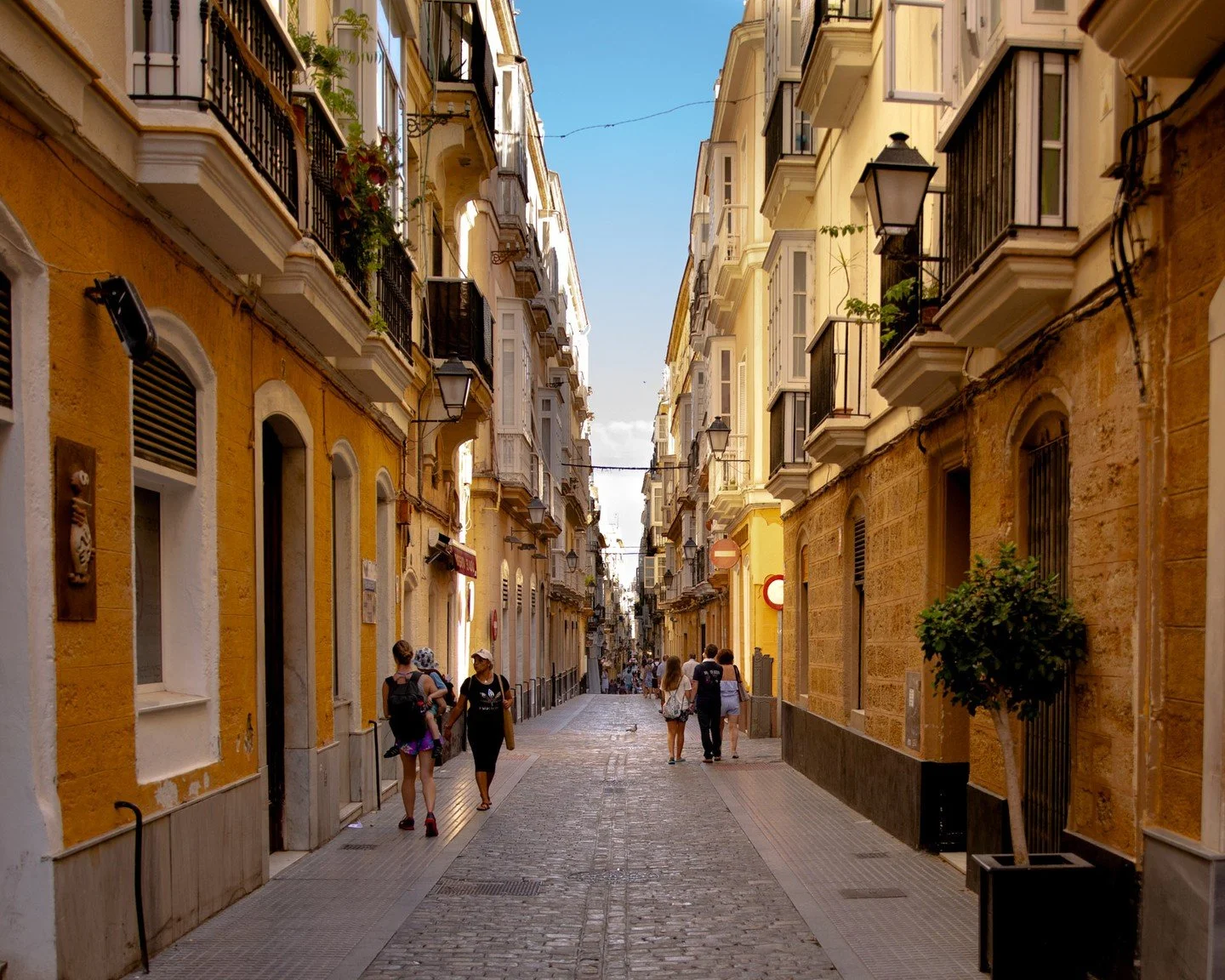 Cadiz, Spain.
Tight enclosed streets burgeoning with people, great food and amazing views. 

Go you have to go.