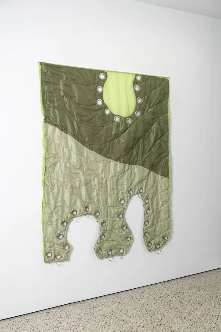 Pierced, 2025, fabric, organza, cotton thread, eyelets, cotton stuffing, stainless steel, 190x140x6.5 cm