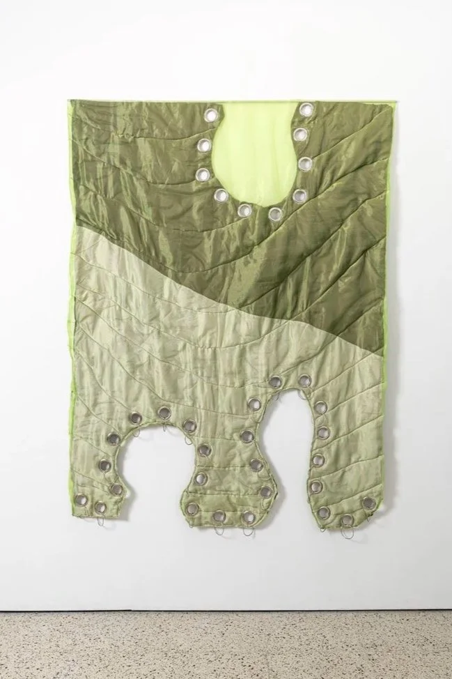 Pierced, 2025, fabric, organza, cotton thread, eyelets, cotton stuffing, stainless steel, 190x140x6.5 cm