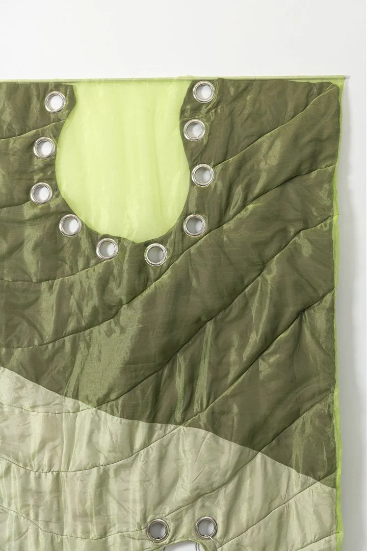 Pierced, 2025, fabric, organza, cotton thread, eyelets, cotton stuffing, stainless steel, 190x140x6.5 cm