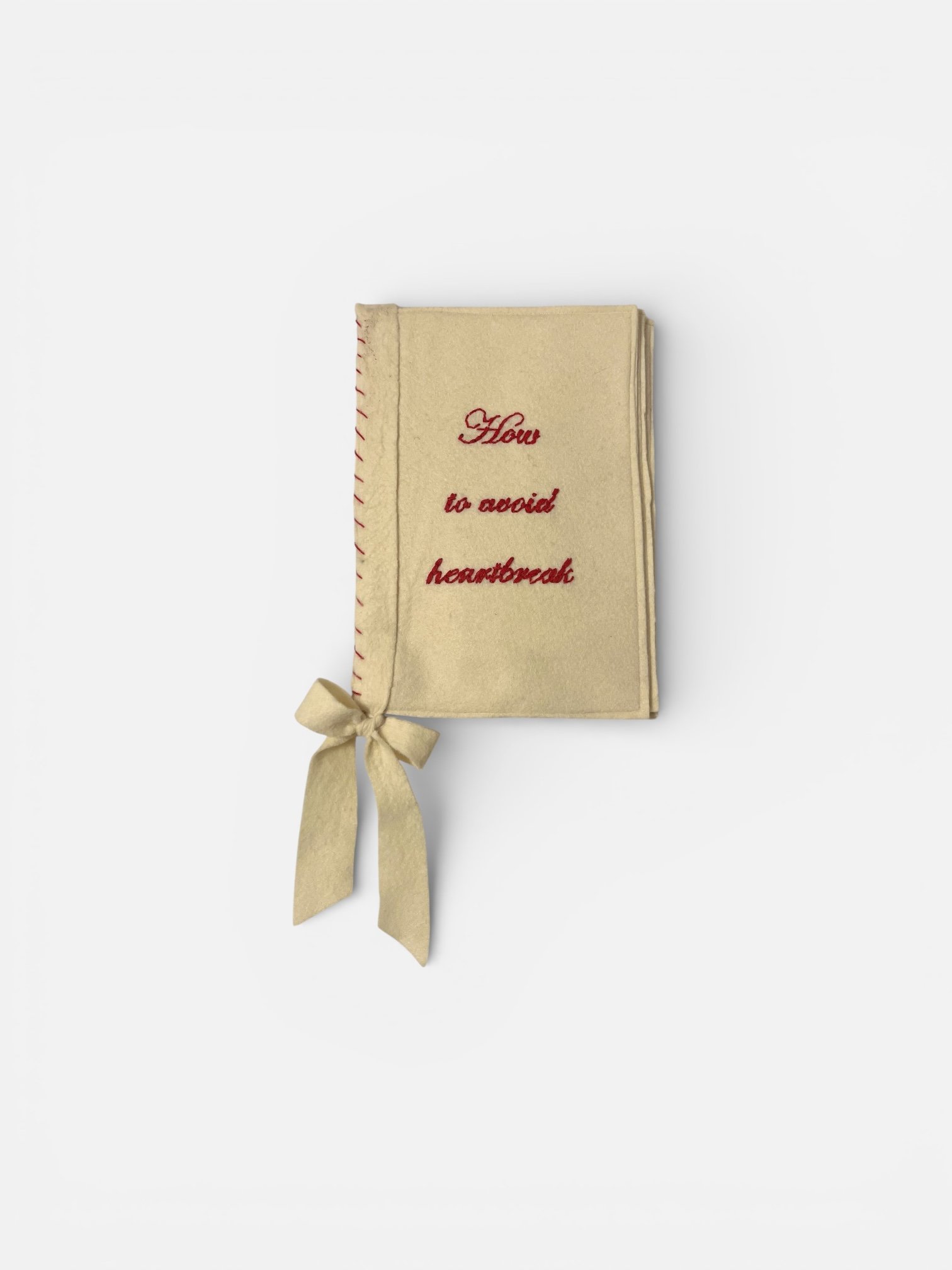 How to avoid heartbreak, 2026 
felt, cotton thread, ribbon
41x21x1.5cm