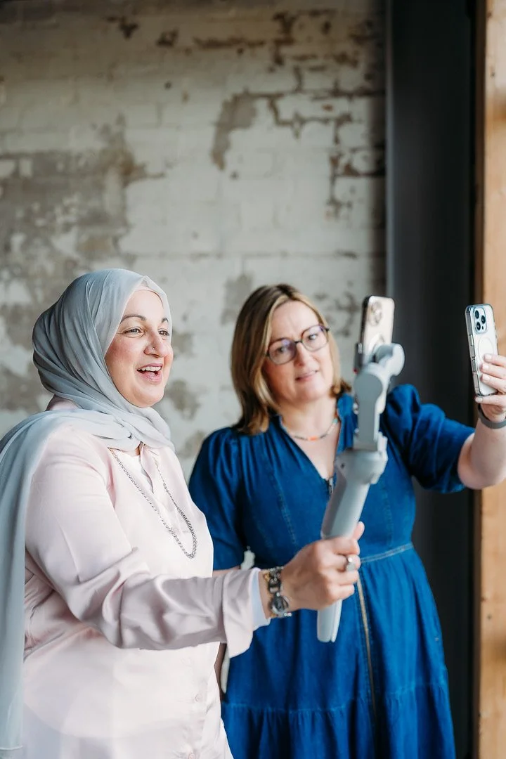 Social mentoring logo with pink and white concentric circles and black text