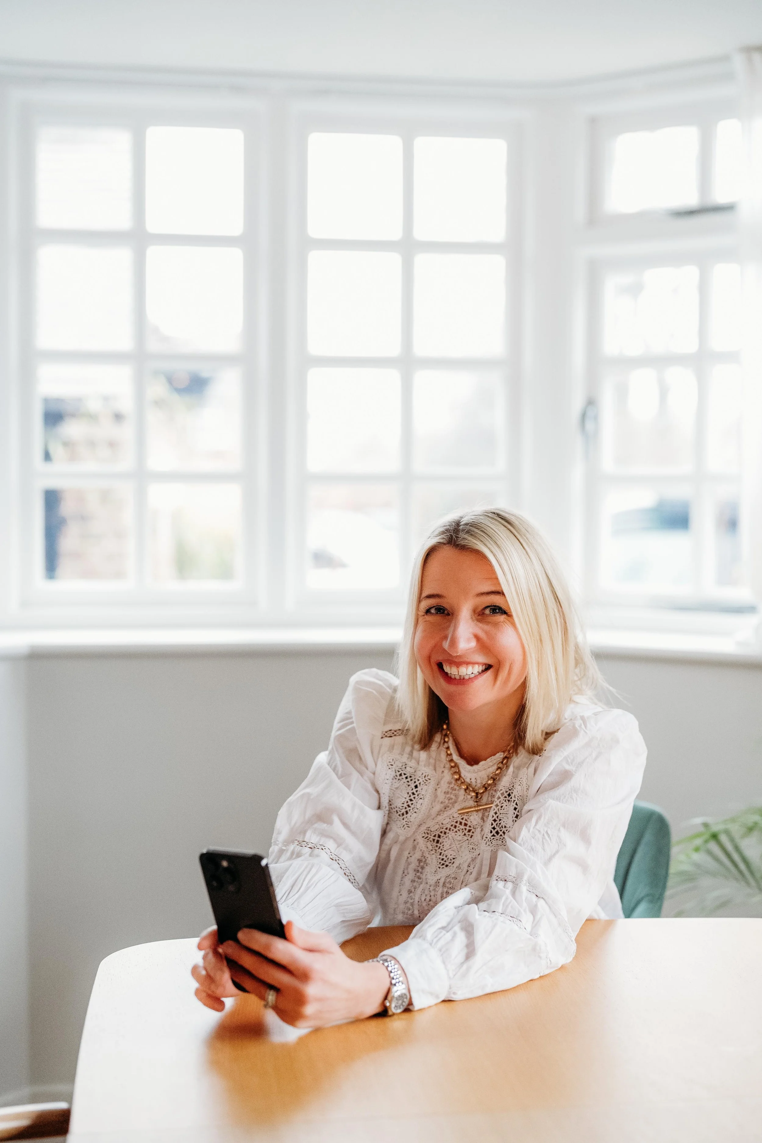Graphic with the words "power hour" in bold, with "power" in dark blue and "hour" in pink, surrounded by pink and white concentric circles.