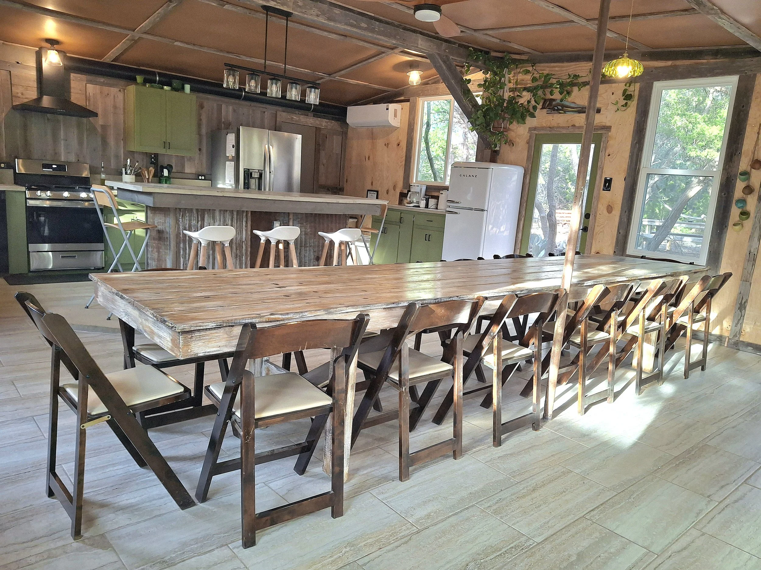 This table can seat 14-18 for a climate controlled dining experience inside the kitchen. 