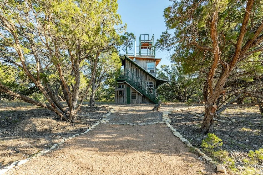 bedroom is upstairs, accessed by outside staircase