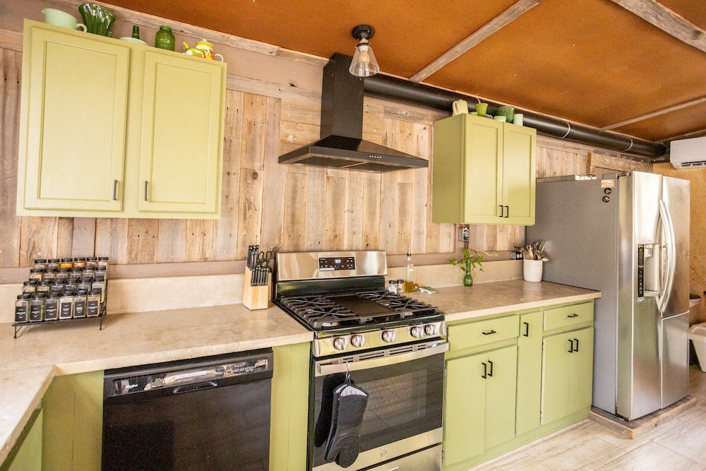 The kitchen is fully closed in with heating/AC and tiled flooring. 