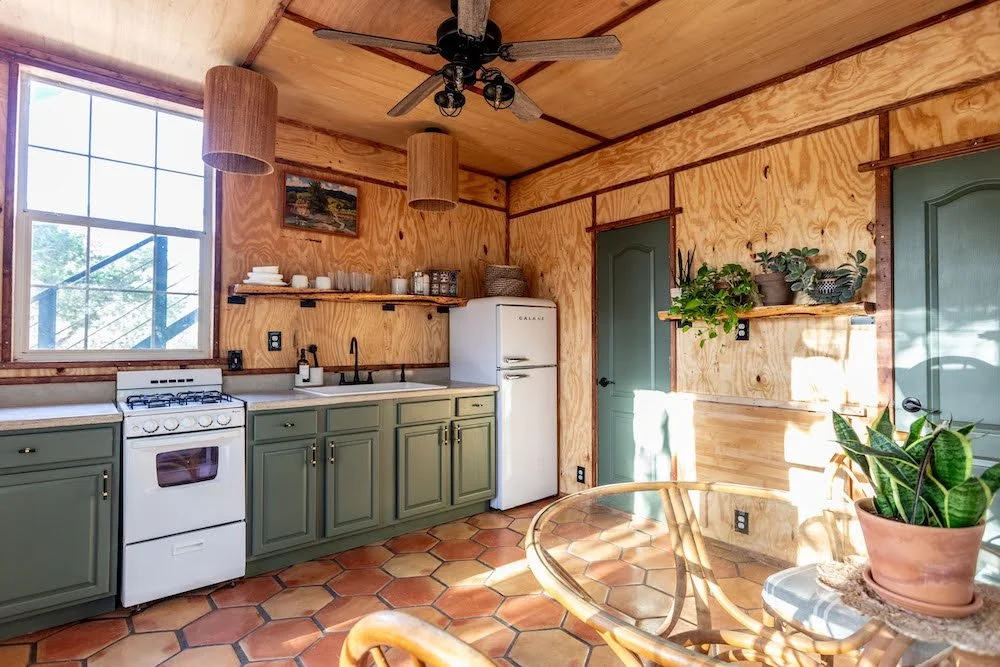 full kitchen downstairs, with the option to put an additional queen bed with linens in place of dining table