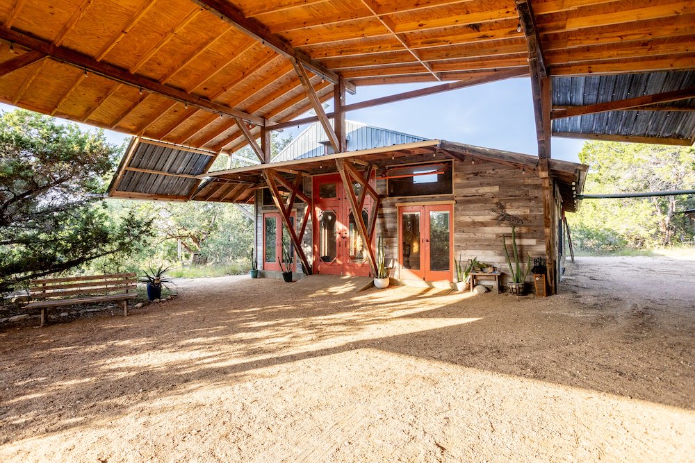 The Workshop (pink doors) is our largest indoor climate controlled space and it is located at the back of this roofed 
Courtyard. 