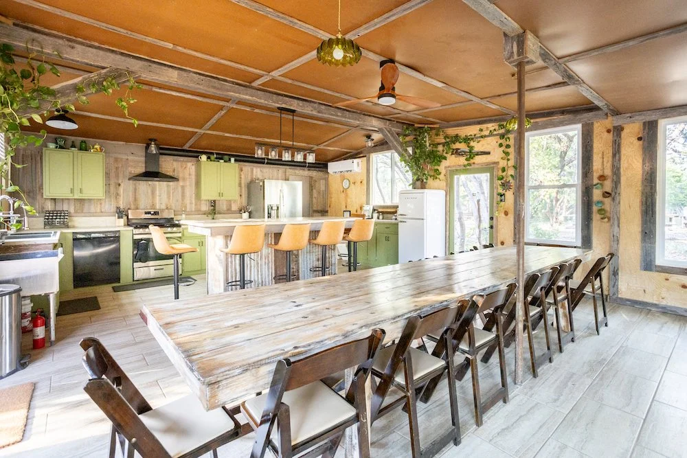 The Kitchen: 
Full indoor kitchen includes 3 fridges, 2 sinks, 5 burner stove/oven, and more. See all amenities by clicking the image.  Ideal for food prep and serving directly to guests or easily converted into a bar or dessert area. The large farmh