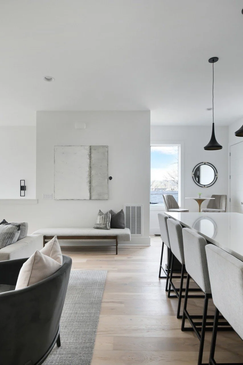 Bright dining nook with large windows and contemporary furnishings in a beautiful Chestnut Hill townhouse